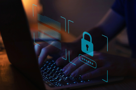 A person typing on a laptop keyboard with a digital security overlay featuring a lock and password field.
